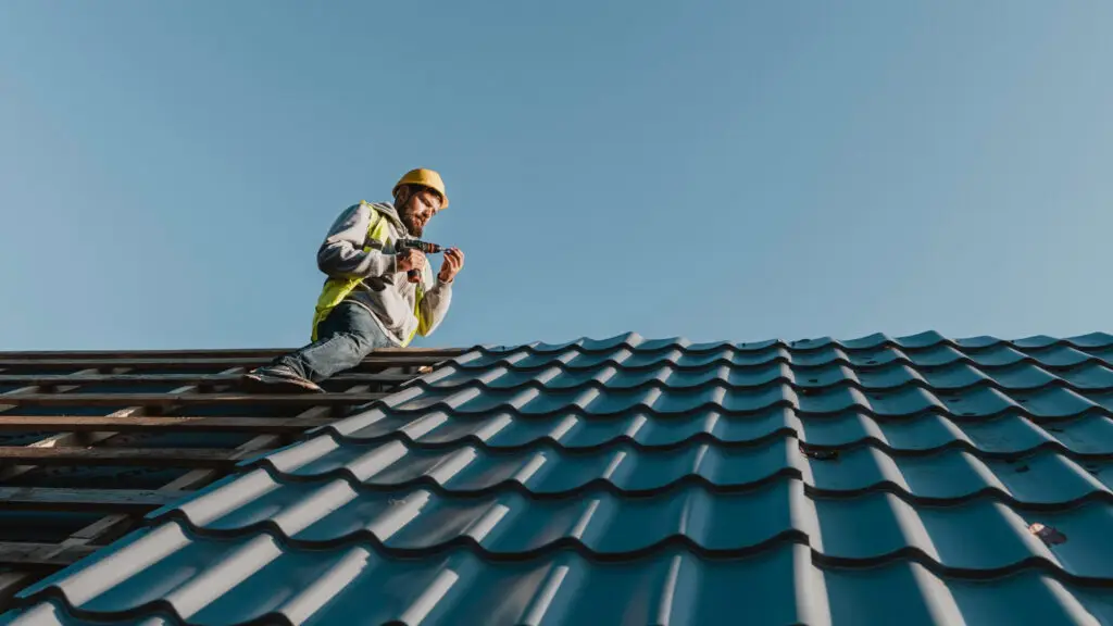 Shingle repair Benton LA roofer working on roof - NELA Roofing